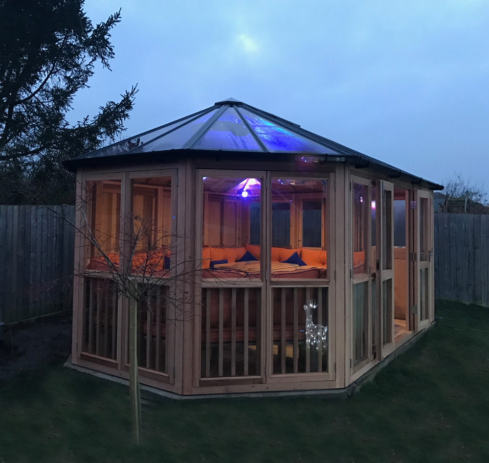 Darwin at Dusk with light on in garden landscape